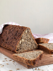 Healthy wholegrain triangular bread on a wooden board. Copy space.