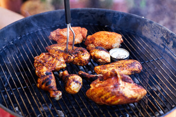 Several Pieces Of Chicken Cooking On Outdoor Grill
