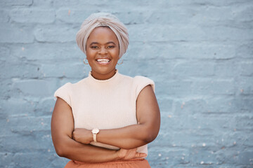 Portrait, smile and black woman with arms crossed on brick wall background with mockup. Happiness, professional and confident, proud and African person, business or female entrepreneur from Nigeria.