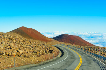Winding Road among Volcanic Rocks and Hills