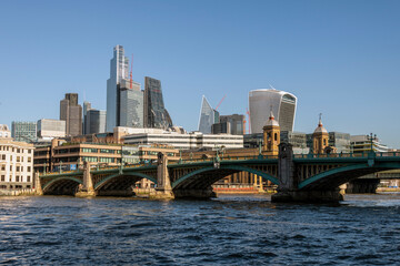 Fototapeta na wymiar The River Thames at Southwark bridge with the city of London behind