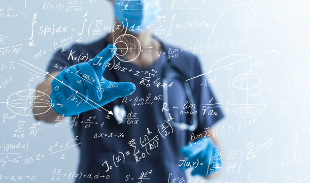 Quantitative analyst is drawing different math formulas on the glass screen.