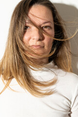 Beautiful natural brunette girl with fluttering hair
