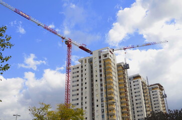 Construction site, construction crane. New building in Israel. Concept: real estate agency,...