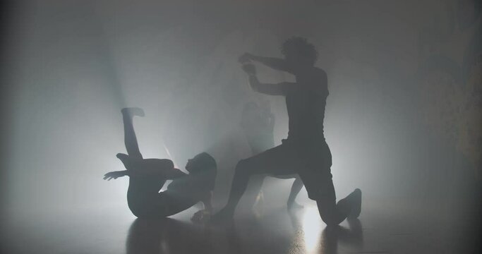 Conceptual dancing in their foggy studio