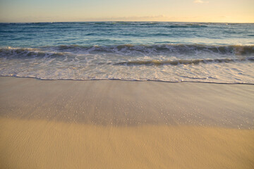 Fototapeta na wymiar Beautiful, wet beach sand and sand ripples as the ocean recedes in the Dominican Republic