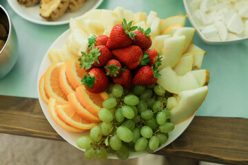 Fruit salad on a white plate. Fresh fruit salad on a white plate.