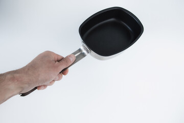Army bowler hat holds a hand on a white flat background