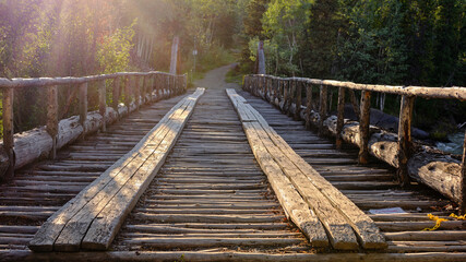 Fototapeta premium One of the old wooden bridges on the Old Alaska Highway built by the Army Corp of Engineers when the Alaska Highway was constructed in the 1940's