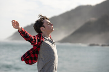 Teenager boy breathing deep outdoors
