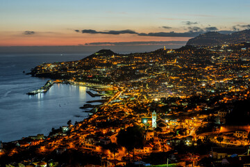 Obraz premium Illuminated cityscape of Funchal, Madeira after sunset at twilight