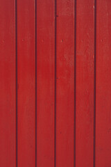 Red wood plank texture of pine grain with knots. Cool wooden background. High quality photo