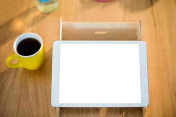 High angle view of digital tablet by headphones