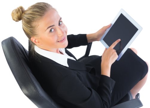 Businesswoman sitting on swivel chair with tablet