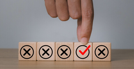 Checkmark and cross icons on wooden cubes on white background. Regulatory compliance, project...