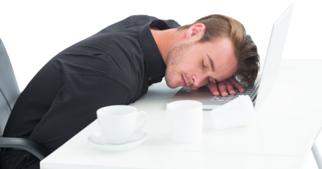 Tired businessman sleeping on laptop