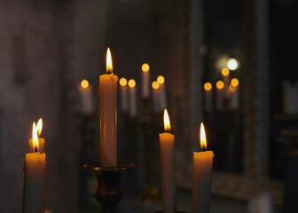 burning candles in the dark of the temple