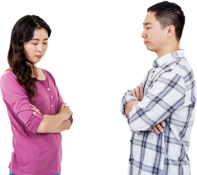 Upset couple standing with arms crossed