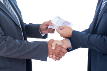 Businessmen shaking hands and exchanging money