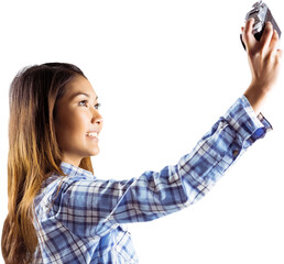 Smiling asian woman taking picture with camera