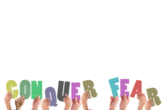 Cropped hands holding colorful words conquer fear  - Powered by Adobe