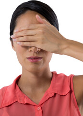 Woman covering her eyes with hand against white background