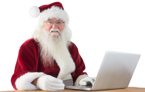 Santa pays with credit card on a laptop