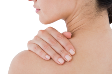 Brunette touching her painful shoulder