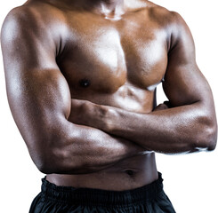 Fototapeta na wymiar Mid section of shirtless athlete standing with arms crossed