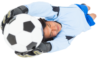 Goalkeeper holding ball while lying down