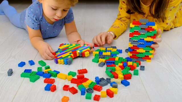 Constructor child plays in the room. Selective focus.