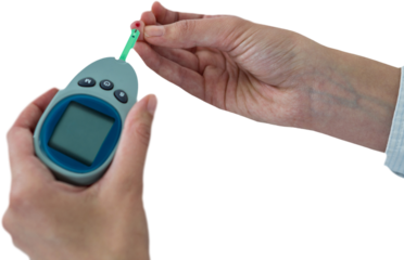 Close up of man hand testing blood sugar with glucometer