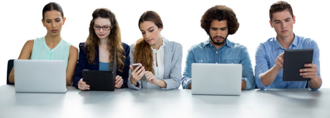 Focused colleagues using technology while sitting against white background