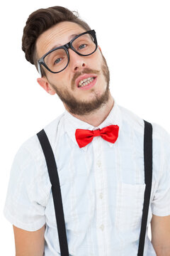 Geeky young hipster looking at camera