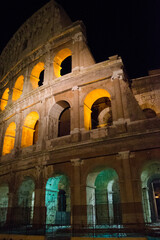 Colosseum - amphitheater, an architectural monument of Ancient Rome. View of the Colosseum in the evening.