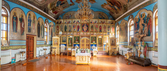 Fototapeta premium SHYMKENT, KAZAKHSTAN - JANUARY 24, 2023: Panorama of the interior of the temple in honor of the icon of the Mother of God of Kazan, Kazakhstan