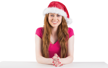 Festive redhead smiling at camera