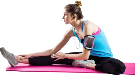 Fit woman exercising on exercise mat