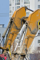 Two excavators on a construction site on a spring day