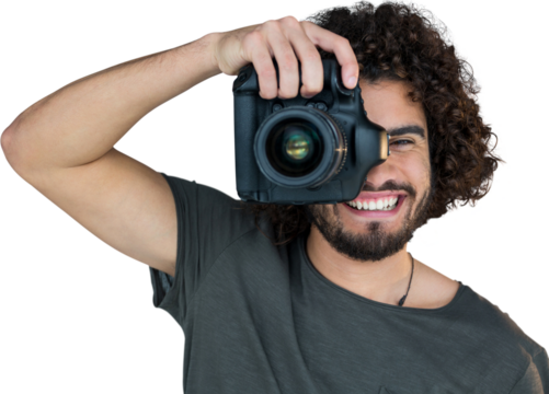 Happy male photographer photographing through camera