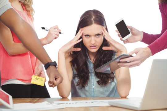 Portrait of depressed businesswoman with head in hands