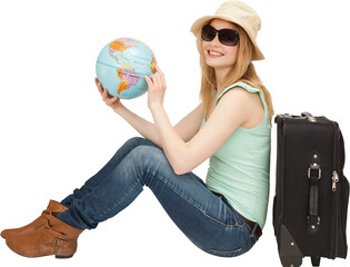 Portrait of woman with globe while sitting by luggage