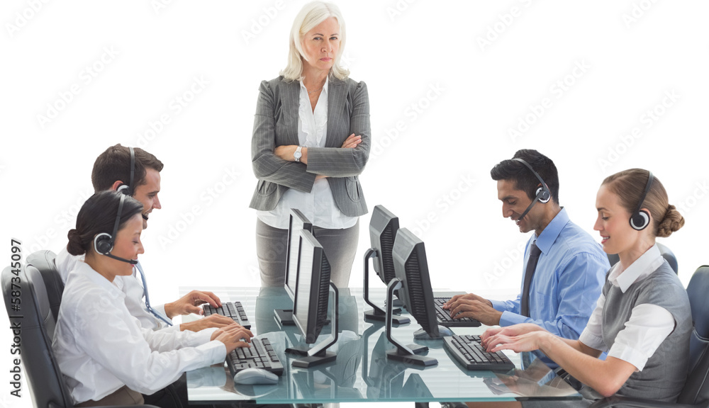 Wall mural Unhappy businesswoman monitoring her colleagues 