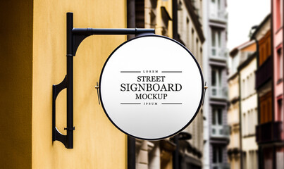 Circle round white signboard on the wall outdoor, mock up for logo design, brand presentation for...