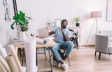 Black man working on laptop at home