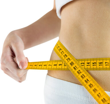 Cropped image of slim woman measuring her waist