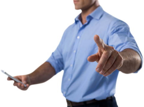 Male executive pressing an invisible virtual screen while using mobile phone