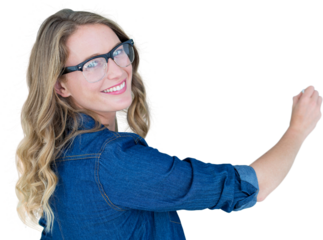 Portrait of smiling woman wearing eyeglasses holding chalk 
