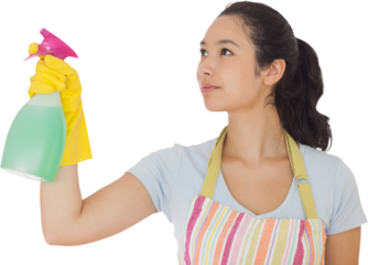 Young woman spraying cleaner