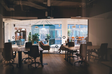 Fototapeta na wymiar Interior of modern workspace with glass windows